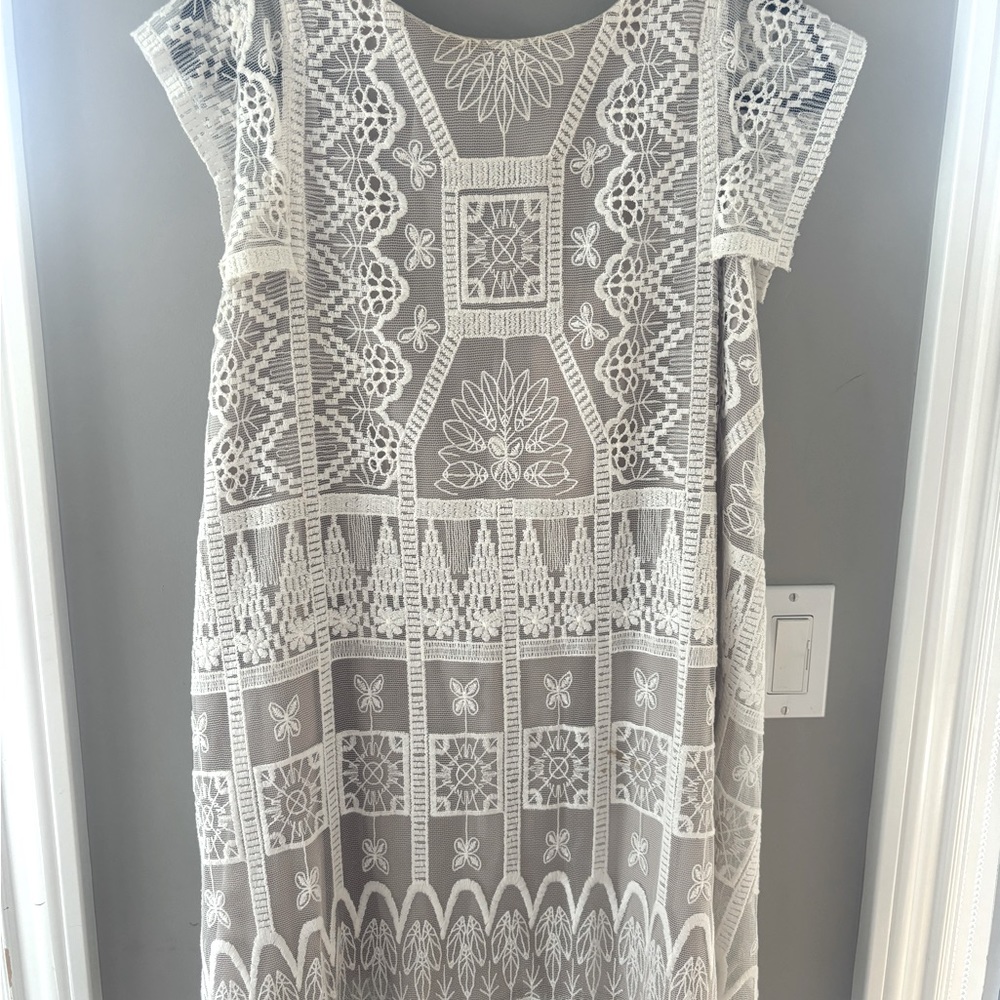 Beautiful off white designer Korovilas slipon dress can be dressy or elegant.